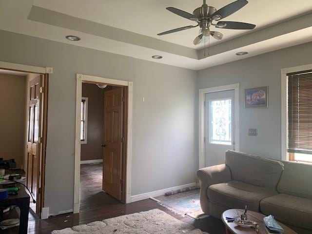 122 Portland Ave, Oglesby, IL 61348 - living area featuring baseboards, a ceiling fan, dark wood finished floors, a raised ceiling, and recessed lighting