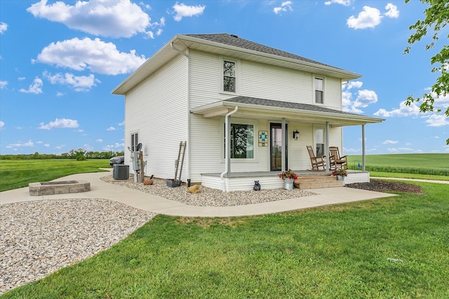 55 N 2600e Rd, Rankin, IL 60960 - view of front of property with covered porch, a front lawn, and cooling unit