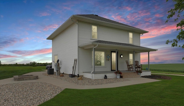 55 N 2600e Rd, Rankin, IL 60960 - view of front facade with covered porch, central AC, and a front yard