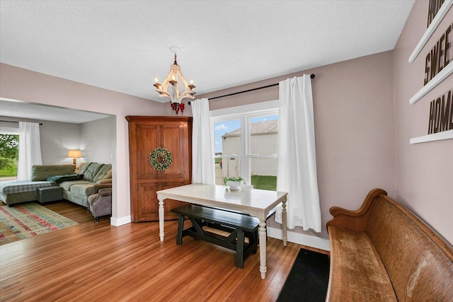 55 N 2600e Rd, Rankin, IL 60960 - dining area with a chandelier, light wood finished floors, and baseboards