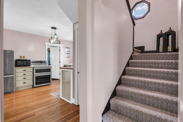 55 N 2600e Rd, Rankin, IL 60960 - stairs featuring wood-type flooring and plenty of natural light