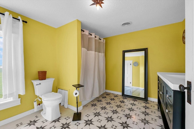 55 N 2600e Rd, Rankin, IL 60960 - full bathroom featuring baseboards, toilet, tile patterned floors, and a textured ceiling