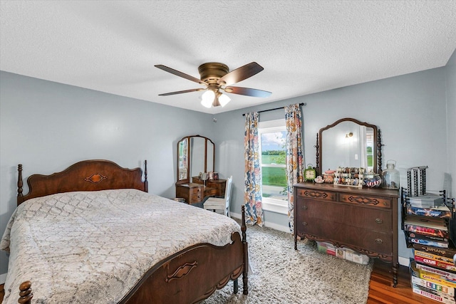 55 N 2600e Rd, Rankin, IL 60960 - bedroom with a ceiling fan, a textured ceiling, baseboards, and wood finished floors
