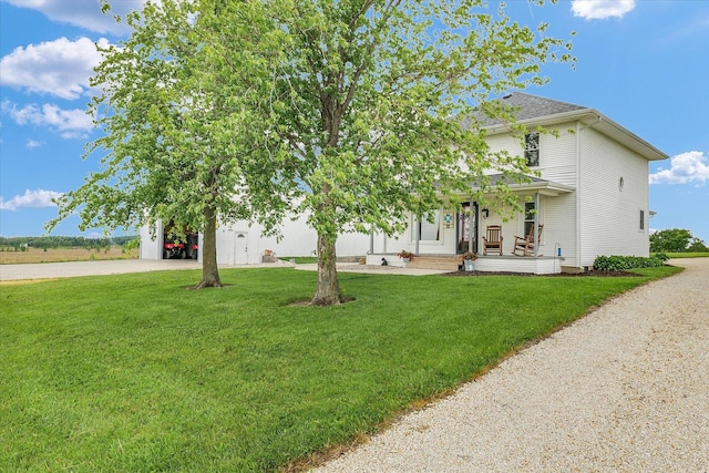 55 N 2600e Rd, Rankin, IL 60960 - view of front of home with covered porch, a front lawn, and driveway