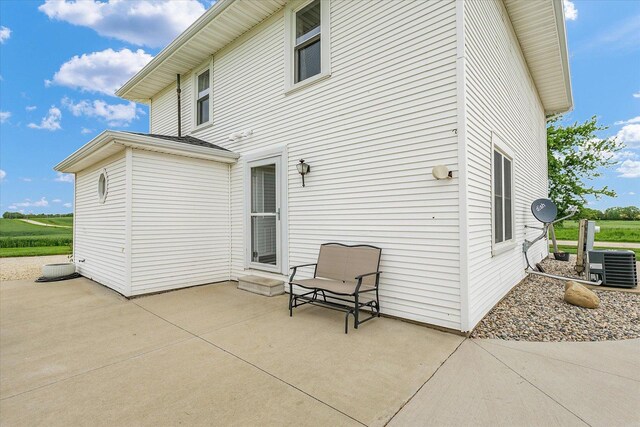 55 N 2600e Rd, Rankin, IL 60960 - rear view of property with central air condition unit and a patio