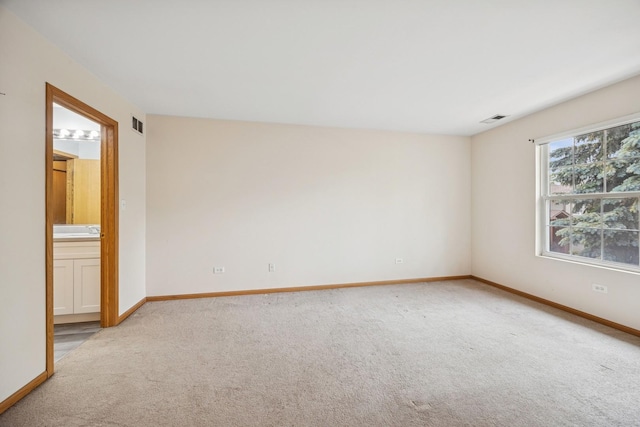 18582 W Point Dr, Tinley Park, IL 60477 - spare room featuring carpet flooring, baseboards, and a sink