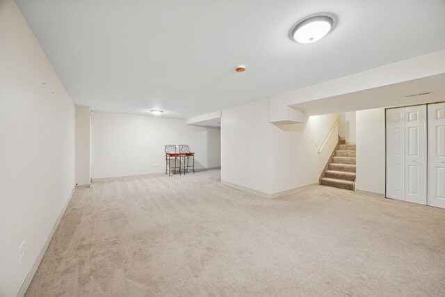 18582 W Point Dr, Tinley Park, IL 60477 - finished basement with light carpet, stairs, and baseboards