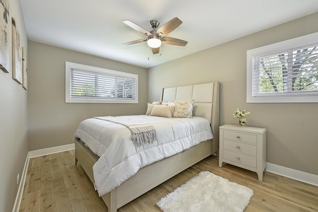 1605 E Euclid Ave, Arlington Heights, IL 60004 - bedroom with baseboards, light wood-style flooring, and ceiling fan