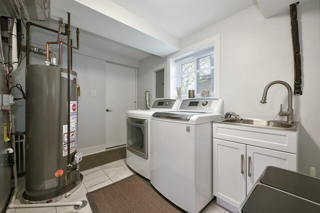 1605 E Euclid Ave, Arlington Heights, IL 60004 - laundry room with cabinet space, washing machine and dryer, water heater, and baseboards