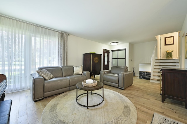 1605 E Euclid Ave, Arlington Heights, IL 60004 - living room featuring plenty of natural light, stairs, and light wood-style flooring
