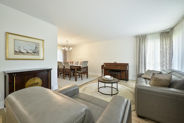 1605 E Euclid Ave, Arlington Heights, IL 60004 - living area with light wood-style floors, a chandelier, and baseboards