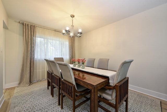 1605 E Euclid Ave, Arlington Heights, IL 60004 - dining space featuring a chandelier, light wood-type flooring, and baseboards