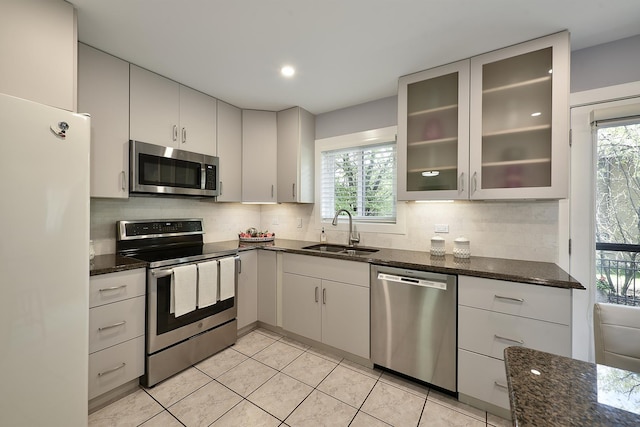 1605 E Euclid Ave, Arlington Heights, IL 60004 - kitchen with appliances with stainless steel finishes, a sink, dark stone countertops, plenty of natural light, and recessed lighting