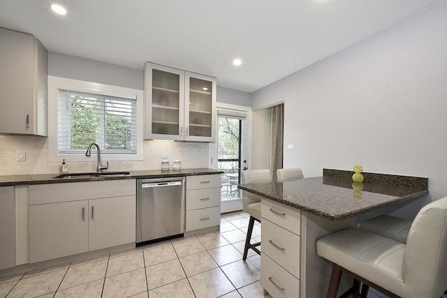 1605 E Euclid Ave, Arlington Heights, IL 60004 - kitchen featuring dishwasher, a sink, a breakfast bar area, plenty of natural light, and recessed lighting