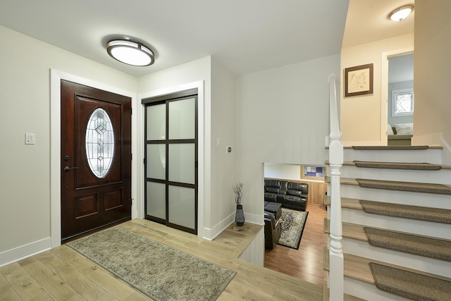 1605 E Euclid Ave, Arlington Heights, IL 60004 - entryway featuring wood finished floors, stairs, and baseboards