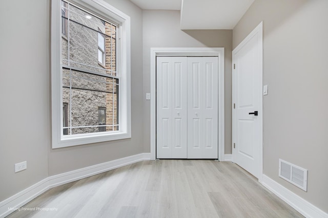 3926 W Arthington St, Chicago, IL 60624 - unfurnished bedroom featuring wood finished floors, baseboards, and a closet