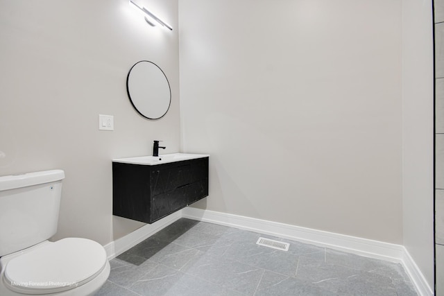 3926 W Arthington St, Chicago, IL 60624 - bathroom with baseboards, toilet, and vanity
