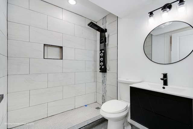 3926 W Arthington St, Chicago, IL 60624 - full bathroom featuring toilet, a tile shower, and vanity
