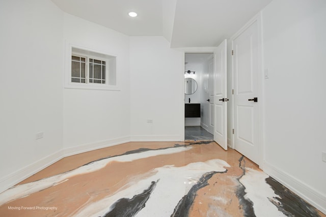 3926 W Arthington St, Chicago, IL 60624 - unfurnished bedroom with baseboards, recessed lighting, and ensuite bath
