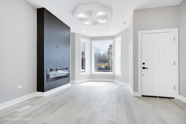 3926 W Arthington St, Chicago, IL 60624 - entryway with light wood-style flooring, baseboards, and recessed lighting