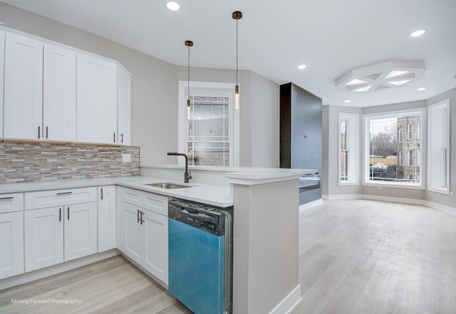 3926 W Arthington St, Chicago, IL 60624 - kitchen featuring dishwashing machine, a sink, light wood-style floors, decorative backsplash, and recessed lighting