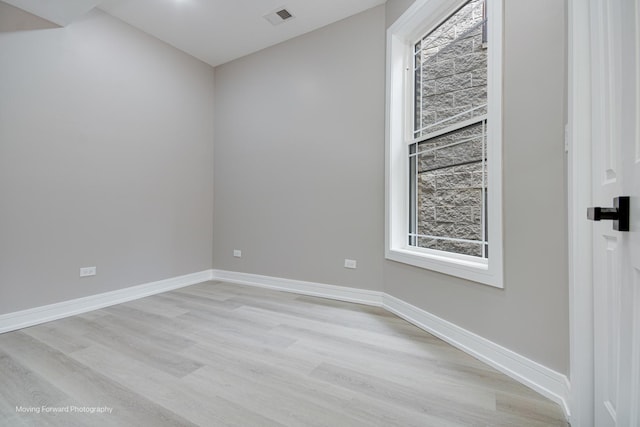3926 W Arthington St, Chicago, IL 60624 - unfurnished room featuring light wood finished floors, baseboards, and healthy amount of natural light