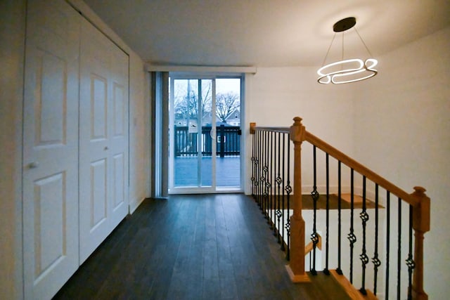 7832 S Evans Ave, Chicago, IL 60619 - hall with dark wood-style flooring, an upstairs landing, a chandelier, and baseboards