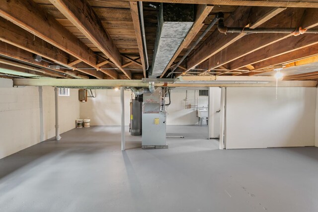 3413 N Schultz Dr, Lansing, IL 60438 - unfinished basement featuring gas water heater, a sink, and heating unit