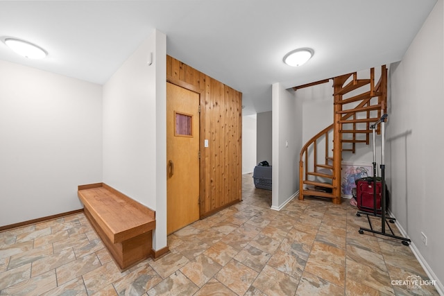 1900 Millburne Rd, Lake Forest, IL 60045 - foyer with stairs, light stone finish flooring, baseboards, and wooden walls