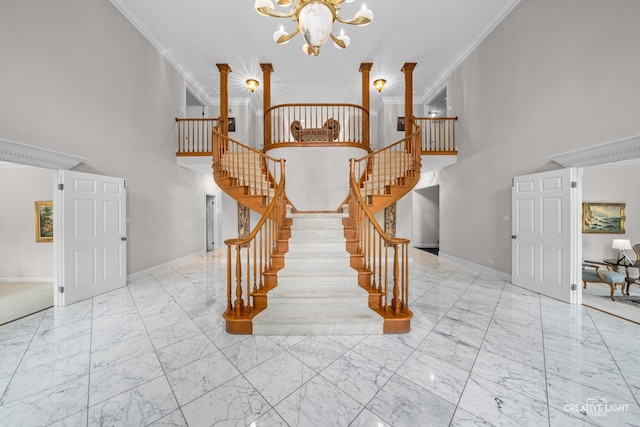 1900 Millburne Rd, Lake Forest, IL 60045 - stairs featuring marble look tile flooring, a chandelier, a high ceiling, baseboards, and crown molding
