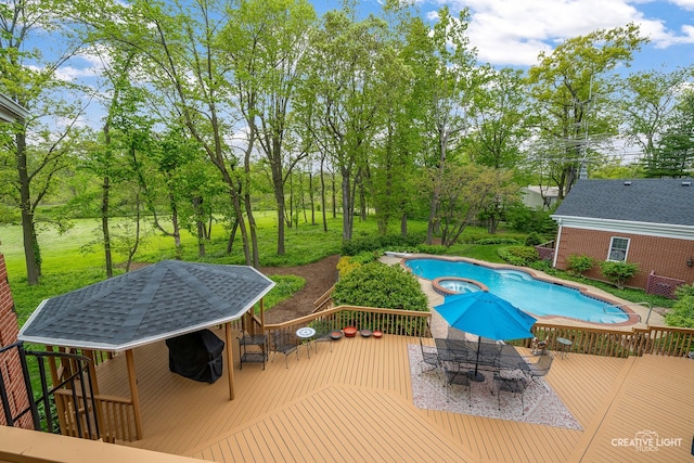 1900 Millburne Rd, Lake Forest, IL 60045 - view of swimming pool featuring outdoor dining area, a wooden deck, and view of scattered trees