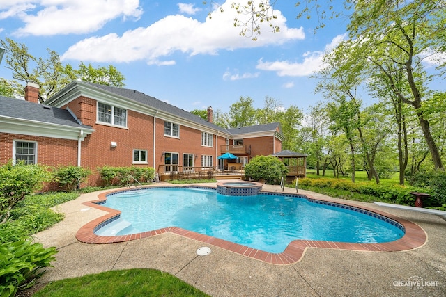 1900 Millburne Rd, Lake Forest, IL 60045 - view of pool with a wooden deck, a gazebo, and a pool with connected hot tub