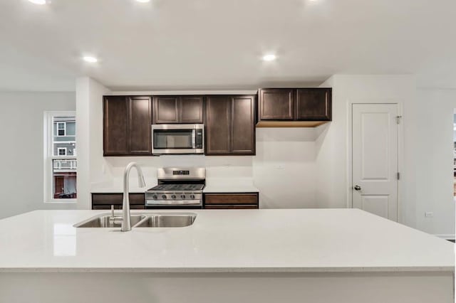 358 Bridgeview Ct, Saint Charles, IL 60174 - kitchen featuring appliances with stainless steel finishes, a sink, dark brown cabinets, and recessed lighting