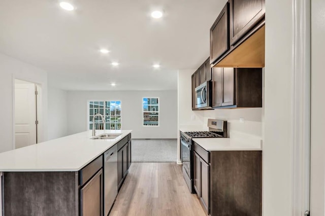 358 Bridgeview Ct, Saint Charles, IL 60174 - kitchen with appliances with stainless steel finishes, a sink, dark brown cabinetry, and recessed lighting
