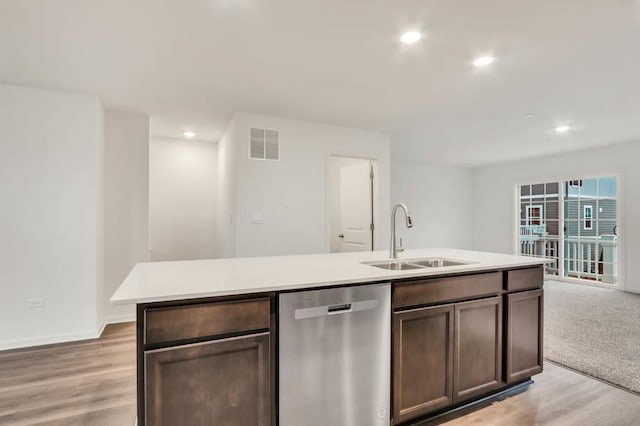 358 Bridgeview Ct, Saint Charles, IL 60174 - kitchen featuring stainless steel dishwasher, a sink, light wood finished floors, light countertops, and recessed lighting
