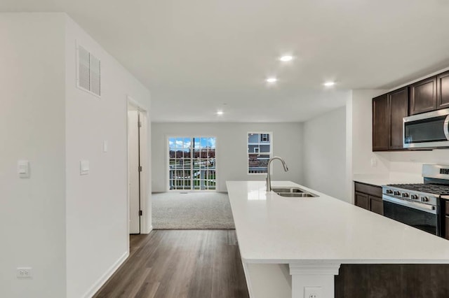 358 Bridgeview Ct, Saint Charles, IL 60174 - kitchen with a sink, stainless steel appliances, dark wood-type flooring, light countertops, and dark brown cabinetry