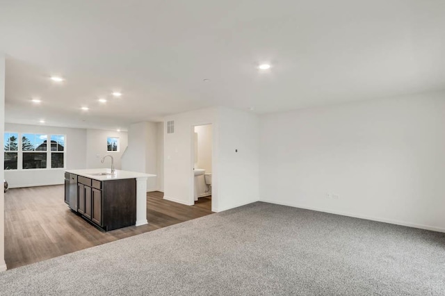 358 Bridgeview Ct, Saint Charles, IL 60174 - kitchen with a sink, recessed lighting, open floor plan, a kitchen island with sink, and light countertops