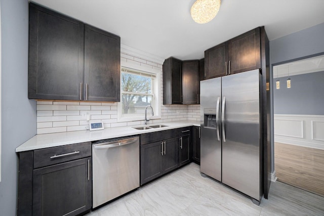 9632 S Yale Ave, Chicago, IL 60628 - kitchen with stainless steel appliances, a sink, light countertops, and decorative backsplash