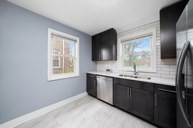 9632 S Yale Ave, Chicago, IL 60628 - kitchen featuring stainless steel appliances, a sink, baseboards, and healthy amount of natural light