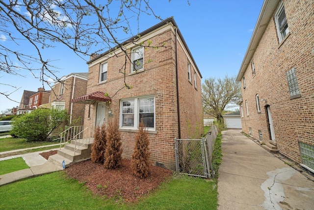 9632 S Yale Ave, Chicago, IL 60628 - view of front of home featuring brick siding, a gate, and crawl space