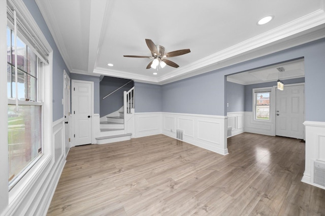 9632 S Yale Ave, Chicago, IL 60628 - unfurnished room with ornamental molding, ceiling fan, a decorative wall, stairs, and a wainscoted wall