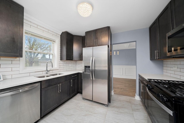 9632 S Yale Ave, Chicago, IL 60628 - kitchen with stainless steel appliances, a sink, light countertops, and backsplash
