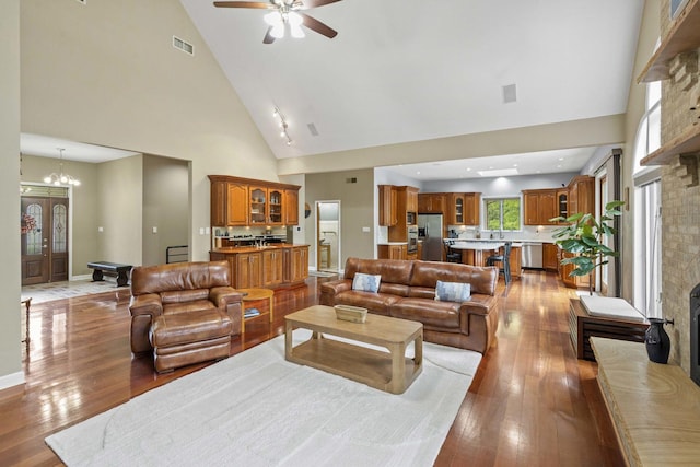 8600 Beall St, Dyer, IN 46311 - living area featuring high vaulted ceiling, hardwood / wood-style floors, ceiling fan, and baseboards