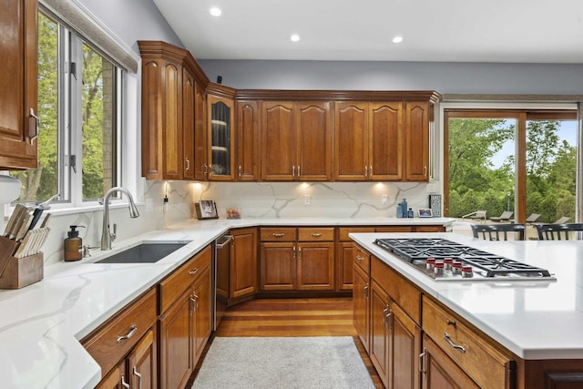 8600 Beall St, Dyer, IN 46311 - kitchen featuring stainless steel appliances, a sink, recessed lighting, light wood-type flooring, and backsplash