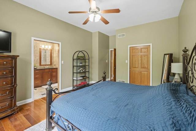 8600 Beall St, Dyer, IN 46311 - bedroom featuring wood finished floors, baseboards, ceiling fan, and ensuite bath