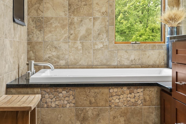 8600 Beall St, Dyer, IN 46311 - bathroom featuring a garden tub and tile walls