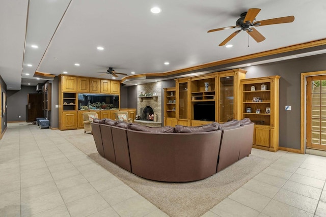 8600 Beall St, Dyer, IN 46311 - living room featuring ceiling fan, baseboards, recessed lighting, light tile patterned flooring, and a brick fireplace