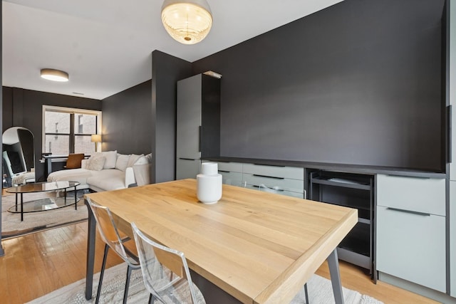 5730 N Hermitage Ave Unit 2, Chicago, IL 60660 - dining area with beverage cooler and light wood-style floors