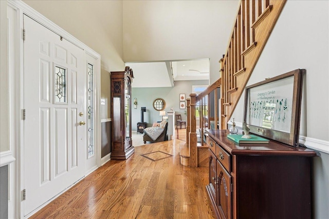 27425 S Steven Ray Dr, Monee, IL 60449 - entrance foyer featuring stairs, light wood-type flooring, and a towering ceiling
