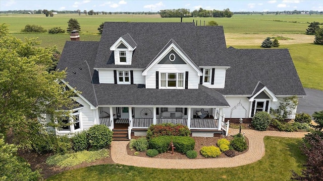 27425 S Steven Ray Dr, Monee, IL 60449 - view of front of house with a porch, a shingled roof, a view of rural / pastoral area, a chimney, and a front lawn